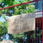 Gate with trespassing sign